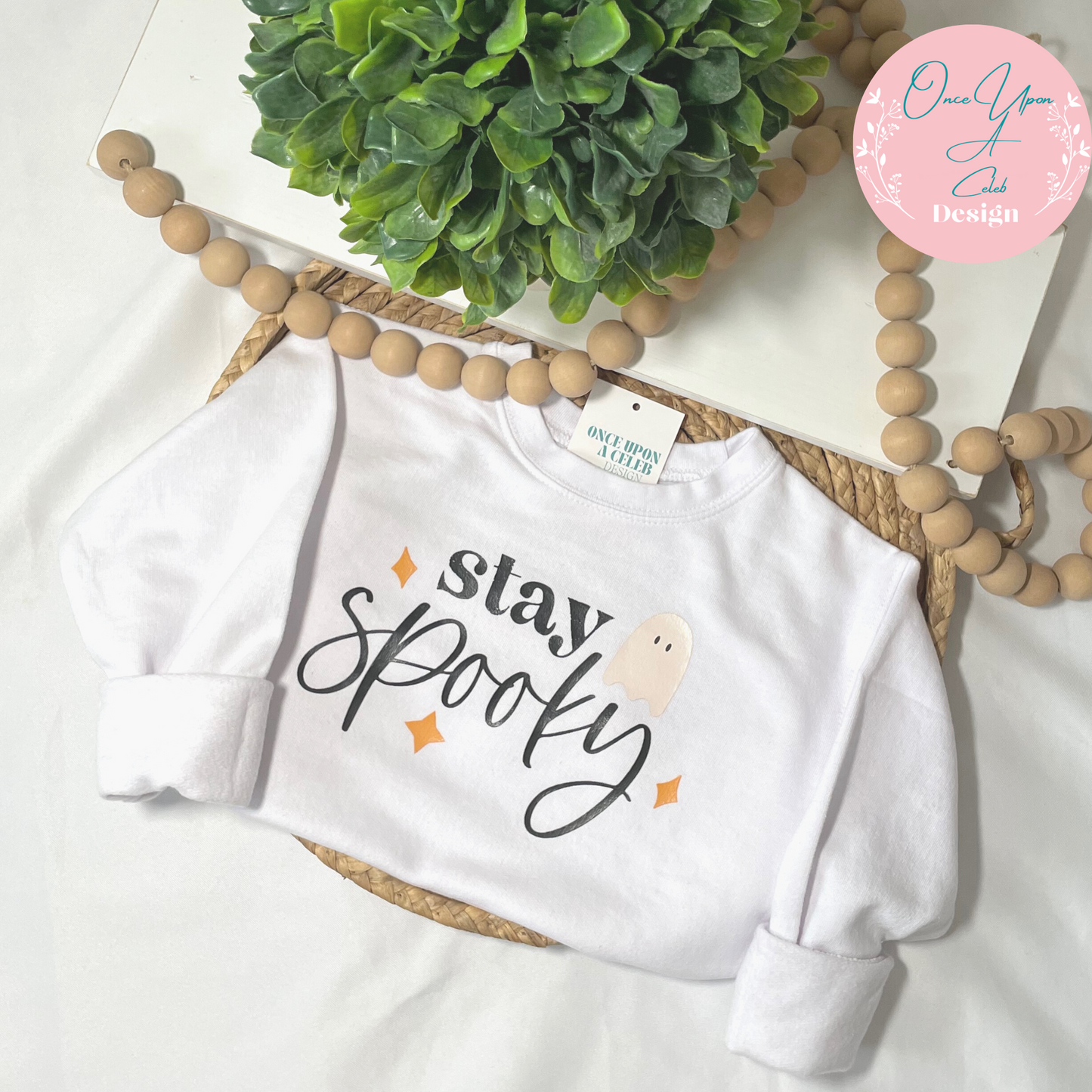 White Stay Spooky Black font with orange stars and white ghost sweatshirt By Once Upon A Celeb Design